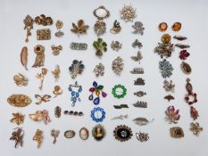 A collection of brooches including Sphinx, six Exquisite, Art Deco, Victorian, Shetland, etc