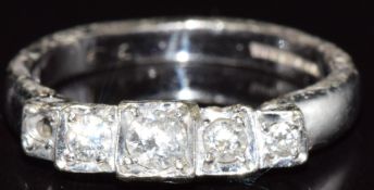 A 9ct gold ring set with four diamonds (damaged), 3.6g
