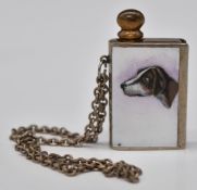 Novelty table lighter or similar, formed as a book with enamel picture of a dog to the cover, height