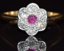 A c1915 18ct gold ring set with a ruby and diamonds, 2.4g, size M
