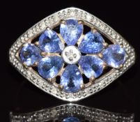 A 9ct gold ring set with tanzanites and diamonds, 2.8g, size U