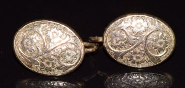 A pair of 9ct gold earrings converted from cufflinks with floral decoration, 2g