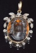 Victorian 9ct gold pendant set with a relief carved citrine cameo depicting a young woman, within