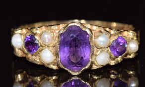 A 9ct gold ring set with amethysts and pearls, 3g, size O