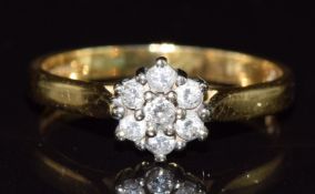 An 18ct gold ring set with a cluster of diamonds, 3.2g, size N