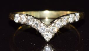 An 18ct gold ring in the shape of a V set with diamonds,  2.8g, size O
