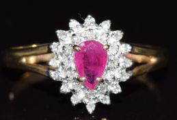 A 9ct gold ring set with a pear cut ruby and diamonds, 2g, size Q