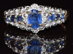 A 9ct gold ring set with sapphires, 2.6g, size O