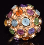 An 18ct gold ring set with tourmaline, peridot, amethyst and citrine in a domed cluster, 4.9g,
