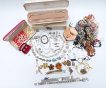 A collection of costume jewellery including faux pearls, brooches, beads, 9ct gold ring, earring and