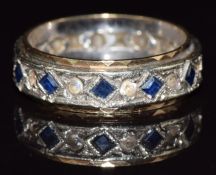 A 9ct gold eternity ring set with spinel and sapphires, 4.3g, size N