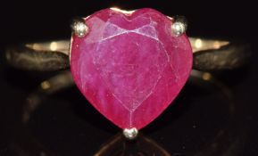 A 9ct gold ring set with a heart cut ruby, 2.8g, size N
