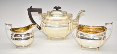 Edward VII hallmarked silver three piece teaset with gadrooned edges, raised on four feet and the