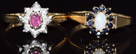 Two 9ct gold rings, one set with a ruby the other with an opal surrounded by sapphires, 3.2g, size