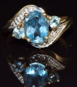 A 9ct gold ring set with blue topaz and diamonds, 2.2g, size J