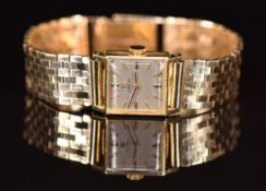 Omega 18ct gold ladies wristwatch ref. 10524 with black hands, gold hour markers, silver dial and