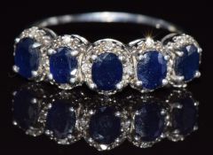 A 9ct white gold ring set with sapphire and diamonds, 3.6g, size X