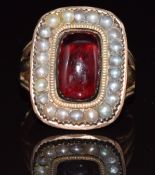 Victorian ring set with a foiled garnet surrounded by seed pearls, 7.3g, size I