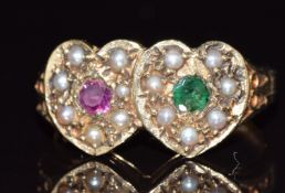 A 9ct gold ring in the form of two hearts set with a ruby, emerald and seed pearls, 3.2g, size M