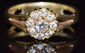 A 14k gold ring set with diamonds in a cluster, 3.9g, size N