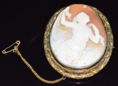 Victorian pinchbeck brooch set with a cameo depicting a woman with a butterfly, gazing up at a star,