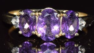 A 9ct gold ring set with amethysts and diamonds, 1.8g, size M