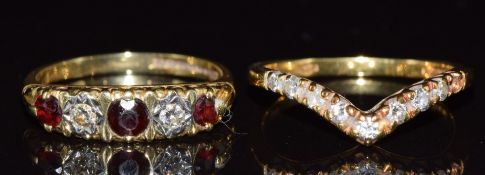 An 18ct gold ring set with diamonds and garnets and an 18ct gold ring set with diamonds in a V