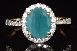 A 9ct gold ring set with a grandidierite and topaz, 3.5g, size S