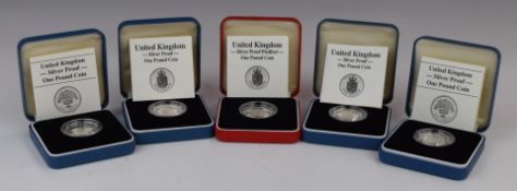 Four Royal Mint silver proof £1 coins and a Piedfort example, all cased with certificates