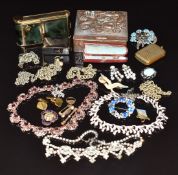 A collection of costume jewellery including vintage necklaces and earrings, watch chains, Japanese