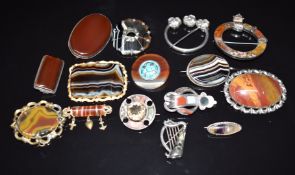 A collection of Victorian agate brooches including eight silver examples, a Celtic or penannular