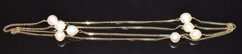 A 9ct gold necklace set with eight pearls, 11.4g