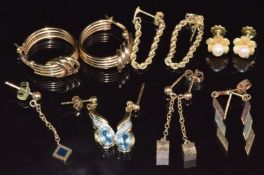 Five pairs of 9ct gold earrings including one pair set with topaz and diamonds (9.1g) and a pair