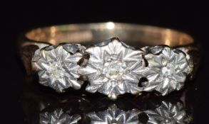A 9ct gold ring set with three diamonds in an illusion setting, 2.4g, size J