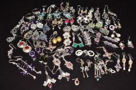 More than 40 pairs of silver earrings including amethyst, peridot, marcasite, abalone, etc