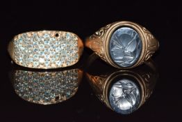 Two 9ct gold rings, one set with zircon the other with carved hematite, 7.1g, sizes T & U