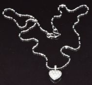 An 18ct white gold pendant set with diamonds on an 18ct white gold chain, 40cm long, 4.4g