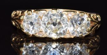 Victorian 18ct gold ring set with three old cut diamonds, the largest approximately 0.85ct, the