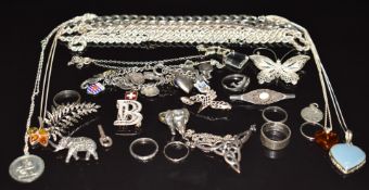 A collection of silver jewellery including St Christopher, rope twist necklace, bracelets, silver