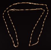 A 15ct gold c1920 fob chain/ necklace made up of sphere and elongated links, 19.1g, 142cm long