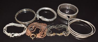 A collection of bracelets and bangles including silver and gold plated bespoke, silver triple, white