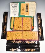 Mah Jong set and four lacquer holders with dragon decoration, length 41cm