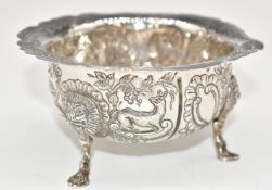 Victorian Irish hallmarked silver sugar bowl with embossed decoration, raised on three feet with