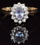 A 9ct gold ring set with a sapphire and diamonds, 2.6g, size O