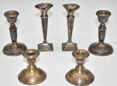 Two pairs of hallmarked silver candlesticks and a pair of hallmarked silver spill vases, height of