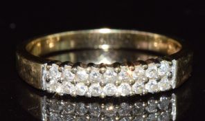 A 9ct gold ring set with two rows of diamonds, 2.1g, size N