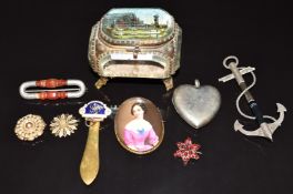 Victorian brooches including a silver example in the form of an anchor set with agate, another