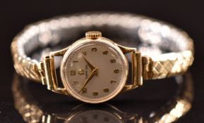 Omega 9ct gold ladies wristwatch ref. 77810 with gold hands and Arabic numerals, silver dial and
