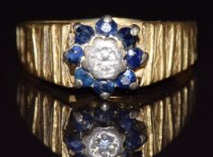 An 18ct gold ring set with a diamond and sapphires, 5g, size R