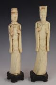 Pair of 19th/20thC carved bone figures of high social status raised on wooden plinths, H28cm